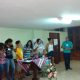 Equipe da Juventude Surda do Rio assume a função de coordenar por 2 anos a Pastoral do Jovem. Estão todos em pé, no salão do Instituto Nossa Senhora de Lourdes, na Gávea.